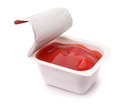Image of ketchup packet that has been opened