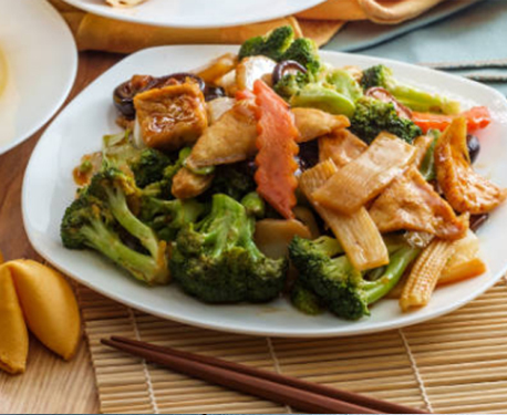 Chinese steamed vegetable dish with chopsticks 