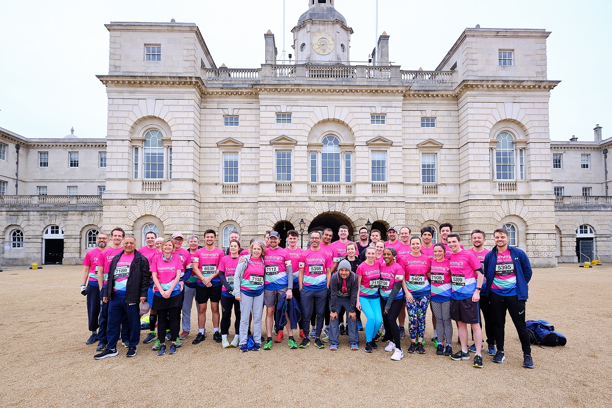 Photo of a large group of runners in Tommy's pink tshirts