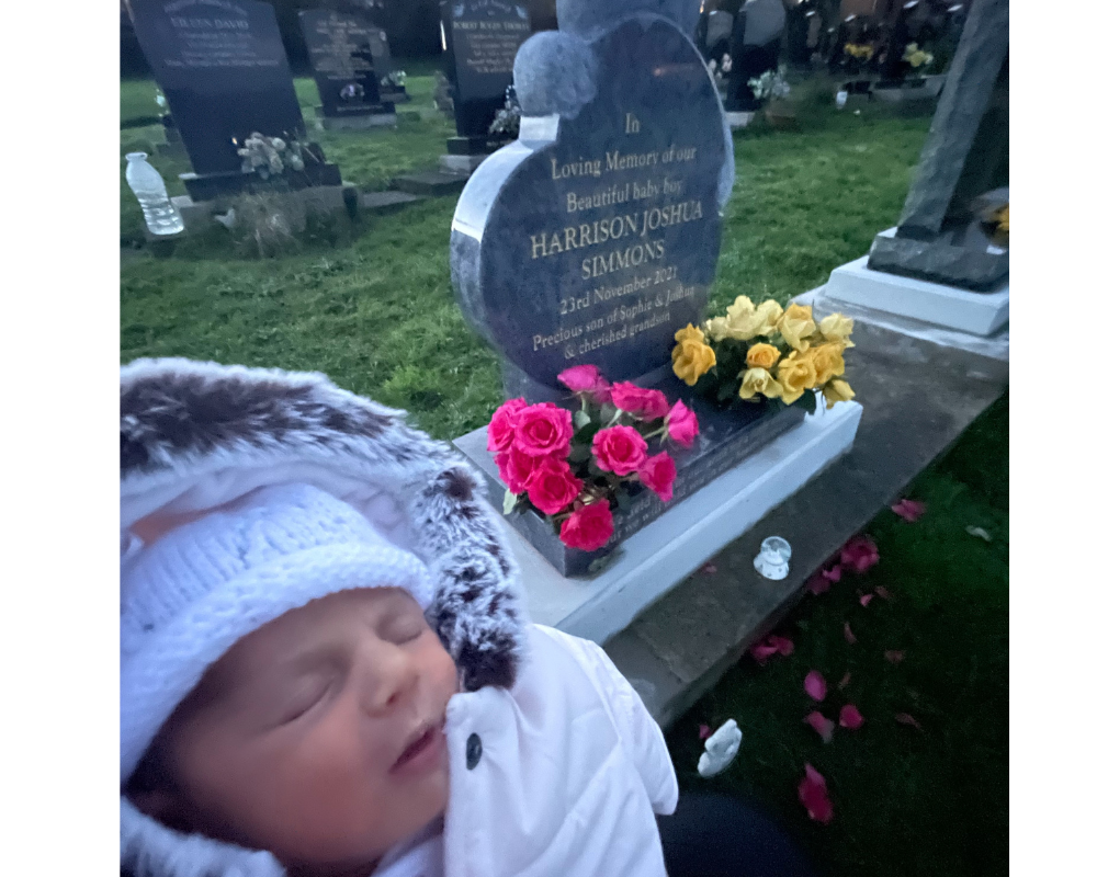 Daisy with her older brother, Harrison's headstone